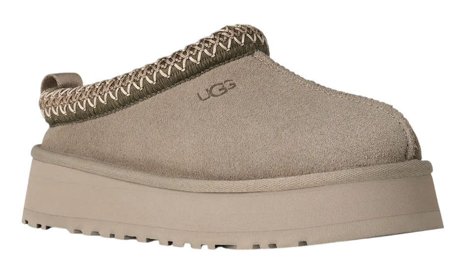 Beige UGG slipper on a white background