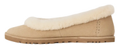 Beige slip-on shoe with white fur lining on a white background