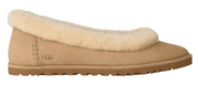 Beige UGG slipper with fluffy trim on a white background