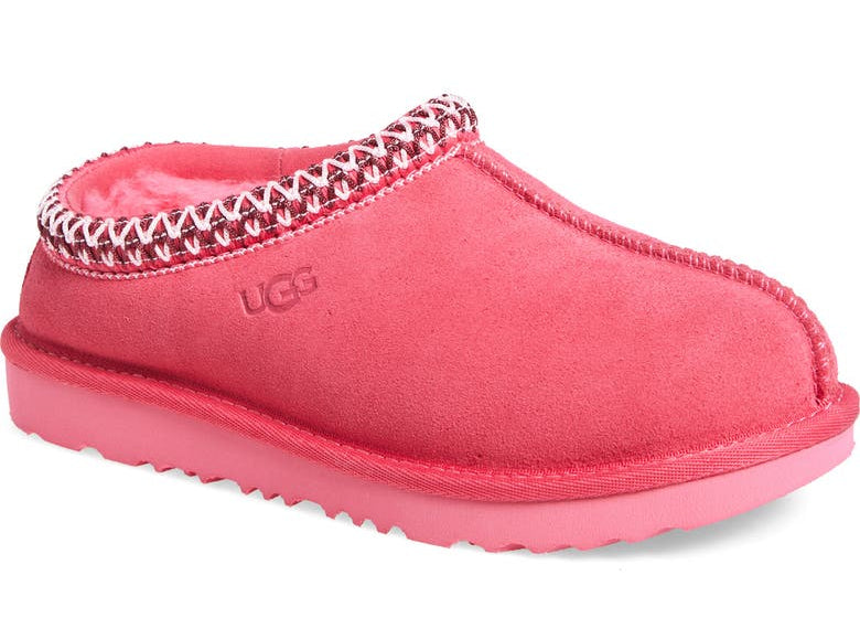 Pink UGG slipper with decorative trim on a white background