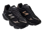 Pair of black athletic shoes with brand logo on a white background - Image 2
