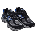 Black and gray sneakers with blue accents on a white background - Image 2