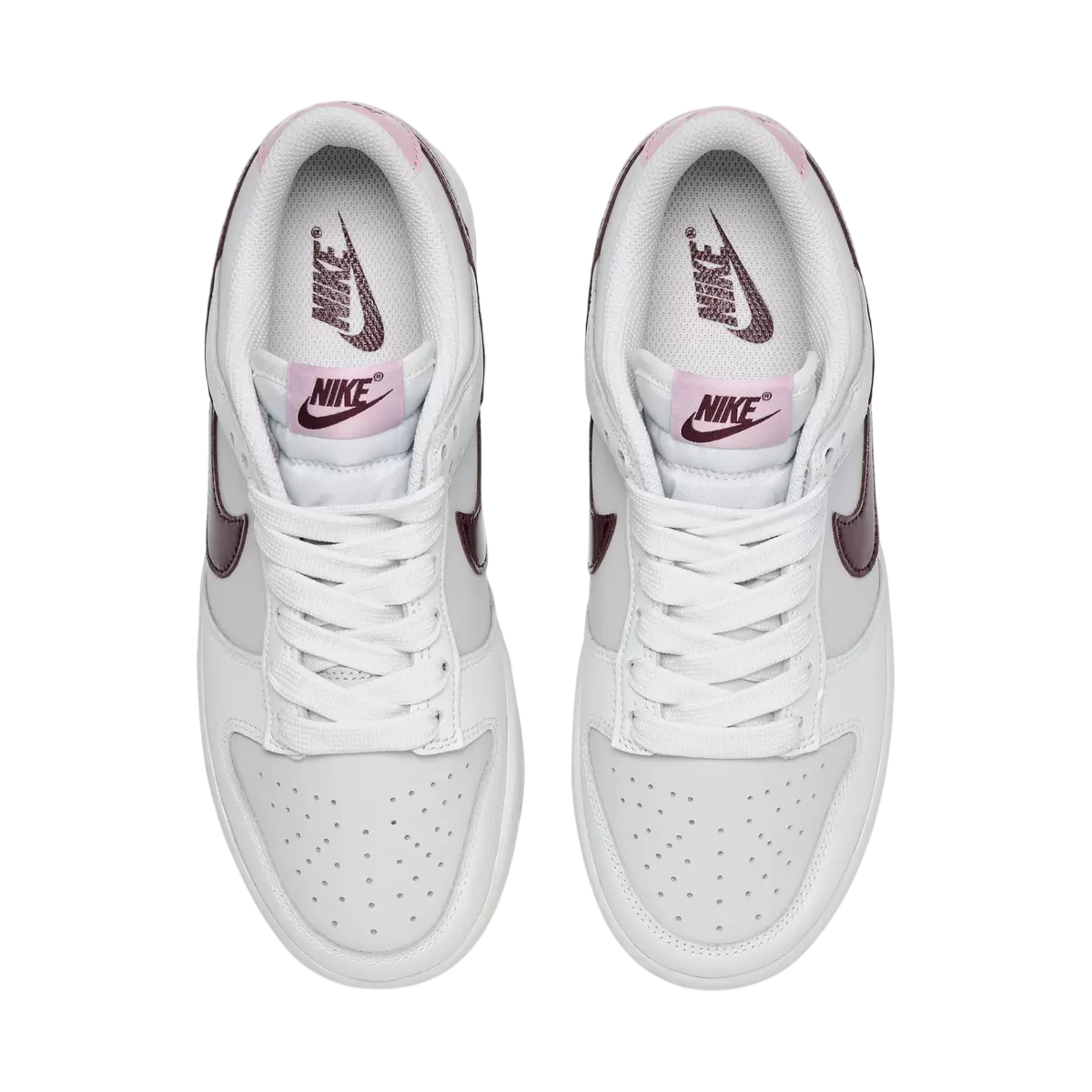 White sneakers with pink accents on a white background