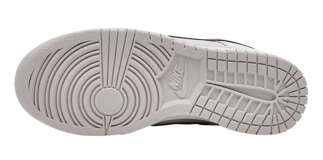 Close-up of a shoe sole with brand logo on a white background
