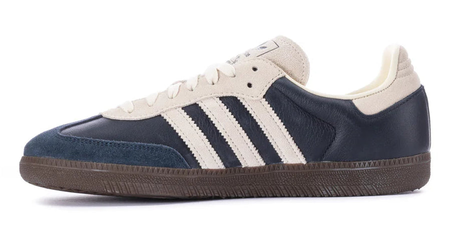 Navy and white sneaker with three stripes on a white background