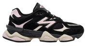 Black and pink sneaker with New Balance logo on a white background