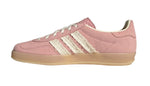Pink Adidas sneaker with three white stripes on a light gray background - Image 3
