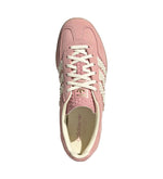 Pink sneaker with white laces on a light gray background - Image 4