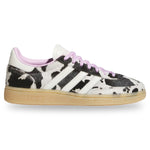 Sneaker with cow print pattern on a white background - Image 1