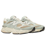 Pair of light gray sneakers with beige accents on a white background - Image 2
