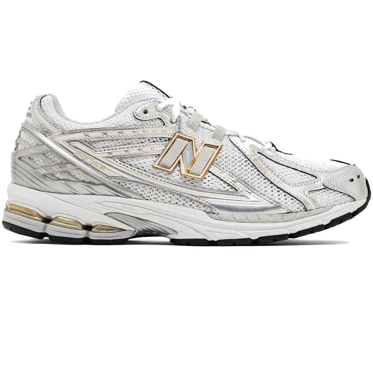 White athletic shoe with gold accents on a white background