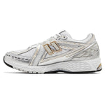 White running shoe with gold accents on a white background - Image 2
