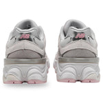 Pair of gray sneakers with pink accents on a white background - Image 3