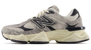 Gray and beige sneaker with New Balance logo on a white background