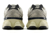 Pair of New Balance sneakers shown from the back on a white background