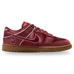 Red sneaker with a brown sole on a white background - Image 1