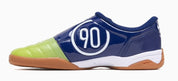 Navy blue and green sports shoe with '90' logo on a white background