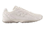 White sneaker with New Balance logo on a white background - Image 1