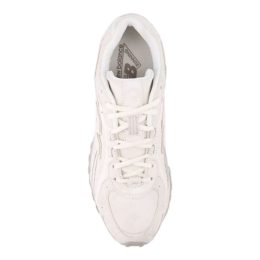 White sneaker with New Balance logo on a light gray background