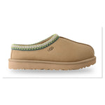 Tan slipper with green trim on a white background - Image 1